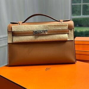 Brand new hermes Kelly pochette mini swift gold color palladium silver hardware